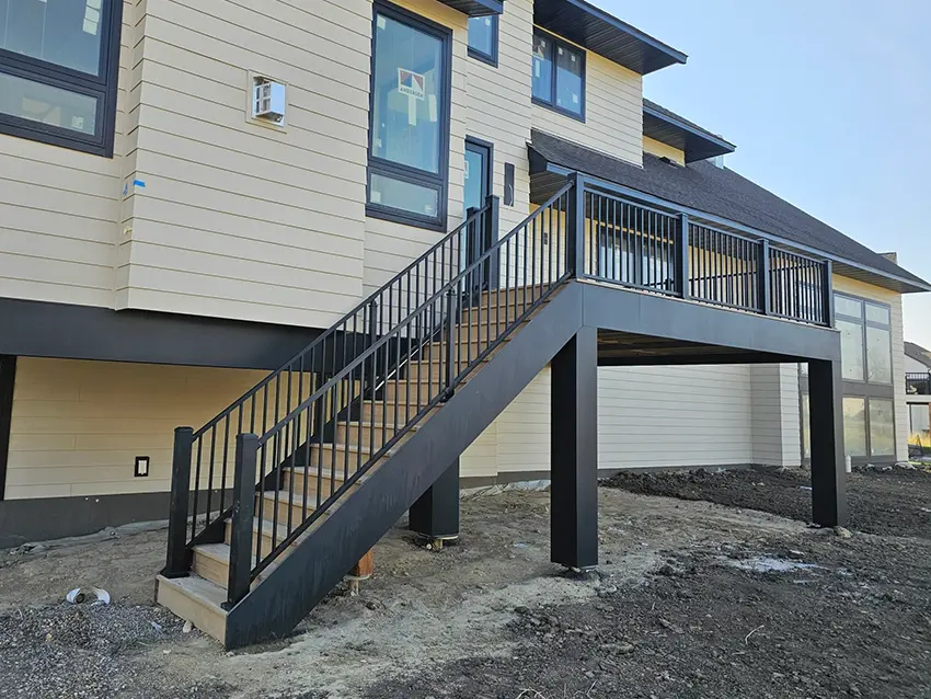 Composite deck boards and black aluminum railings
