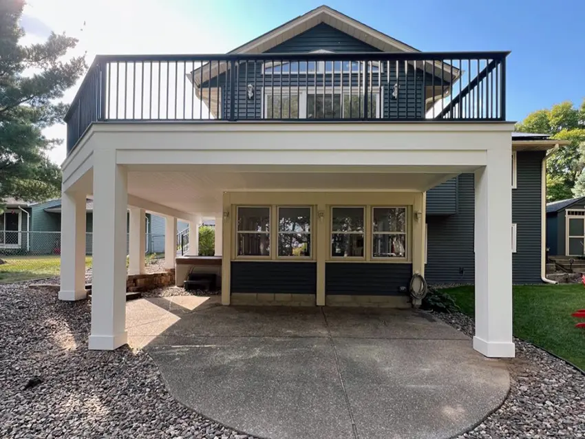 Two-level deck with black railings and broad stairs